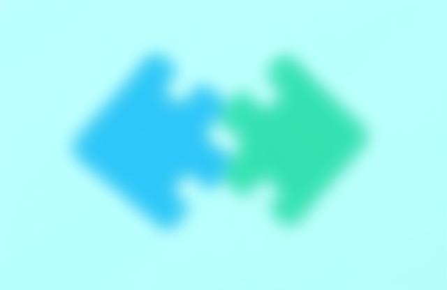 Illustration representing post-merger integration, showing two puzzle pieces fitting together.